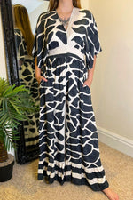 MERLA Giraffe Print Jumpsuit - Black (NO RETURNS)